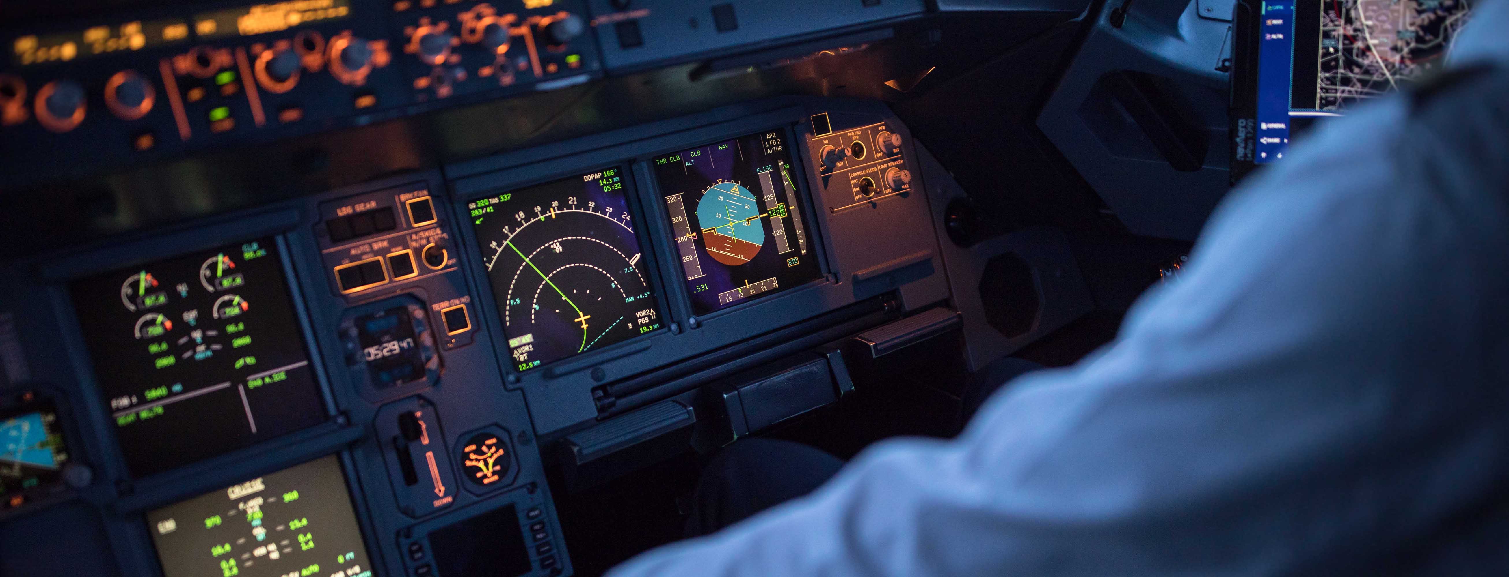 Close up on flight instrument panels in a commercial aircraft