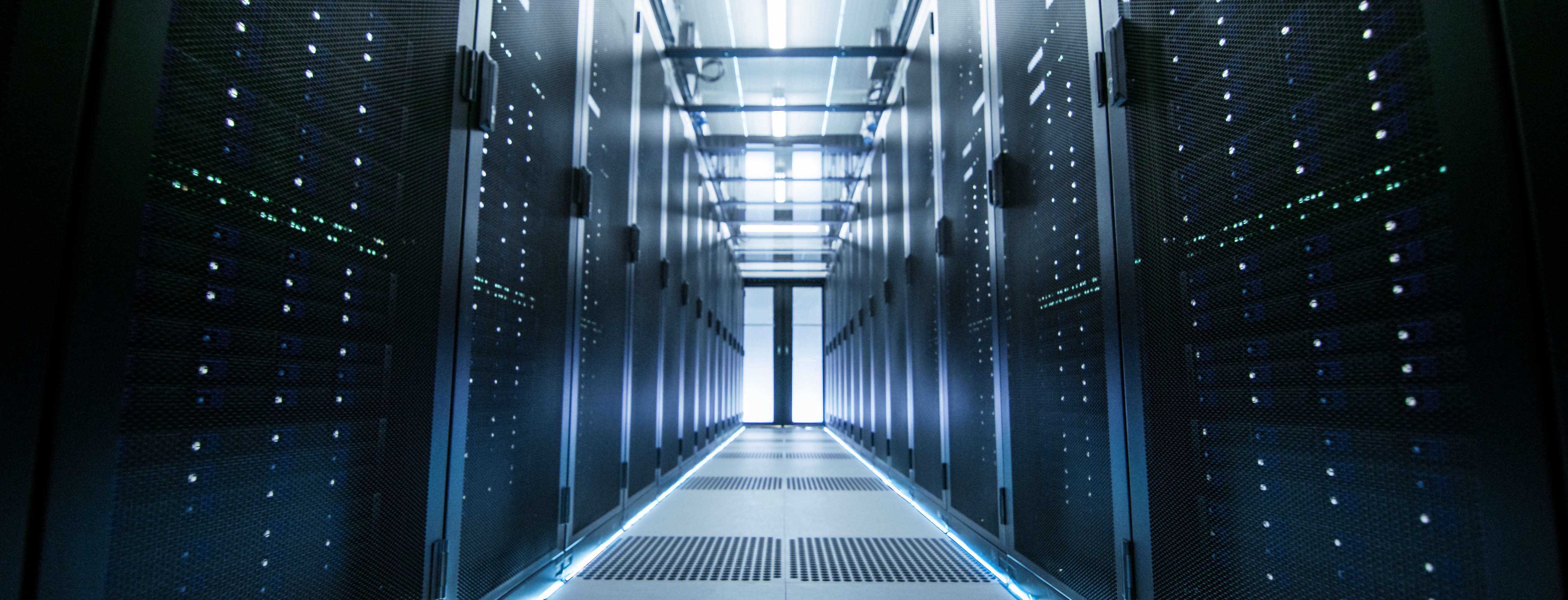 A long corridor between two rows of server racks